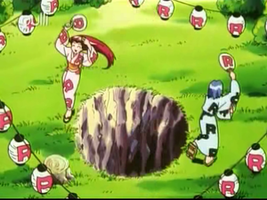 EP130 - Costume Devise Team Rocket.png